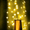 a glass of champagne with sparks bokeh Royalty Free Stock Photo