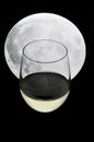 Glass of champagne under a full moon Royalty Free Stock Photo