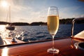 Glass of champagne on yacht in ocean, luxury lifestyle holiday travel