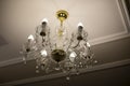 Glass chandelier. Ceiling light source Royalty Free Stock Photo