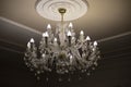 Glass chandelier. Ceiling light source Royalty Free Stock Photo
