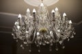 Glass chandelier. Ceiling light source Royalty Free Stock Photo