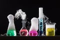 Glass in a chemical laboratory filled with colored liquid during Royalty Free Stock Photo