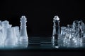 Glass chess kings facing each other on a glass board Royalty Free Stock Photo