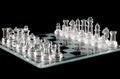 Glass chess over black Royalty Free Stock Photo