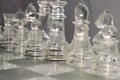 Glass chess pieces, Chess pieces arranged on a glass chess board Royalty Free Stock Photo