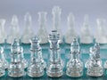 Glass Chess Pieces on a Frosted Glass Royalty Free Stock Photo