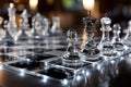 Glass Chess Pieces on Illuminated Board Royalty Free Stock Photo