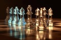 glass chess pieces reflecting light on board Royalty Free Stock Photo