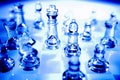 Glass chessboard and pieces Royalty Free Stock Photo