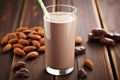 a glass of chocolate almond milk smoothie