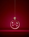 Glass christmas bauble hanging in front of luxury dark red background Royalty Free Stock Photo