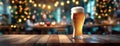 A glass of Christmas beer ale on wooden table with dark shiny garland background. Panorama with copy space. Royalty Free Stock Photo