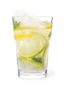 Glass of citrus refreshing drink with ice cubes on white