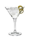 Glass of classic martini cocktail with ice cubes and lemon zest on white Royalty Free Stock Photo