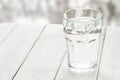 Glass of water with half full water on the table, concept of positive and negative thinking Royalty Free Stock Photo