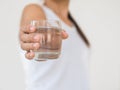 A glass of clean mineral water in woman`s hands. Concept of envi Royalty Free Stock Photo