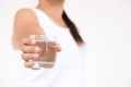 A glass of clean mineral water in woman`s hands. Royalty Free Stock Photo