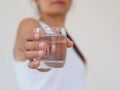 A glass of clean mineral water in woman`s hands. Concept of envi Royalty Free Stock Photo