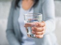 A glass of clean mineral water in woman`s hands. Concept of envi Royalty Free Stock Photo