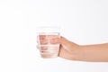 A glass of clean mineral water in woman`s hands. Concept of environment protection, healthy drink and healthcare Royalty Free Stock Photo