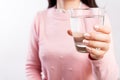 A glass of clean mineral water in woman`s hands. Concept of environment protection, healthy drink and healthcare Royalty Free Stock Photo