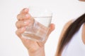 A glass of clean mineral water in woman`s hands. Royalty Free Stock Photo