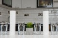 A glass of clean water with osmosis filter and cartridges on white table in a kitchen interior. Concept Household filtration Royalty Free Stock Photo