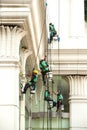 Glass cleaner abseiling from a tall building. Royalty Free Stock Photo