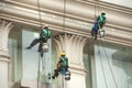 Glass cleaner abseiling from a tall building.