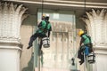 Glass cleaner abseiling from a tall building.
