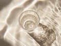 Glass of Clear Water with Caustic Light Reflections Royalty Free Stock Photo