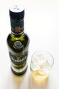 Glass and closed bottle of Glenfiddich whisky