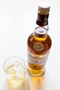 Glass and closed bottle of Glenlivet Scotch whisky