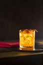 Glass of the cocktail negroni on a old wooden board. Drink with gin, campari martini rosso and orange, an italian cocktail, an Royalty Free Stock Photo