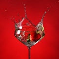 Glass with cocktail and splashing strawberry Royalty Free Stock Photo