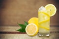 Glass of cocktails with lemon on blurred