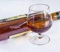 Glass of cognac and bottlle Royalty Free Stock Photo
