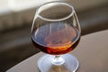 glass of cognac on a wooden table in the bar. Royalty Free Stock Photo