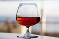 glass of cognac on a wooden table in the bar. Royalty Free Stock Photo
