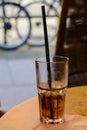 Glass with cola drink and a drinking straw Royalty Free Stock Photo