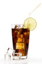Glass of cola with ice cubes, lime and straw on white backgroun Royalty Free Stock Photo