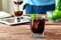 Glass of cola with ice and mint Royalty Free Stock Photo