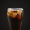 Glass of cola with ice over black background Royalty Free Stock Photo