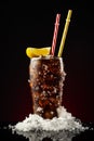 Glass cola with ice and straw. Cold glass of cola with lemon Royalty Free Stock Photo