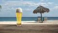 Glass with cold beer with sea or ocean beach on background Royalty Free Stock Photo
