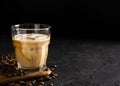 glass cold brew coffee with ice and milk on black or dark background Royalty Free Stock Photo