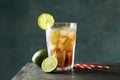 Glass of cold cola with citrus and ice on wooden table Royalty Free Stock Photo