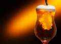 Glass of cold craft light beer on dark background. Royalty Free Stock Photo