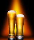 Glass of cold craft light beer on dark background. Royalty Free Stock Photo